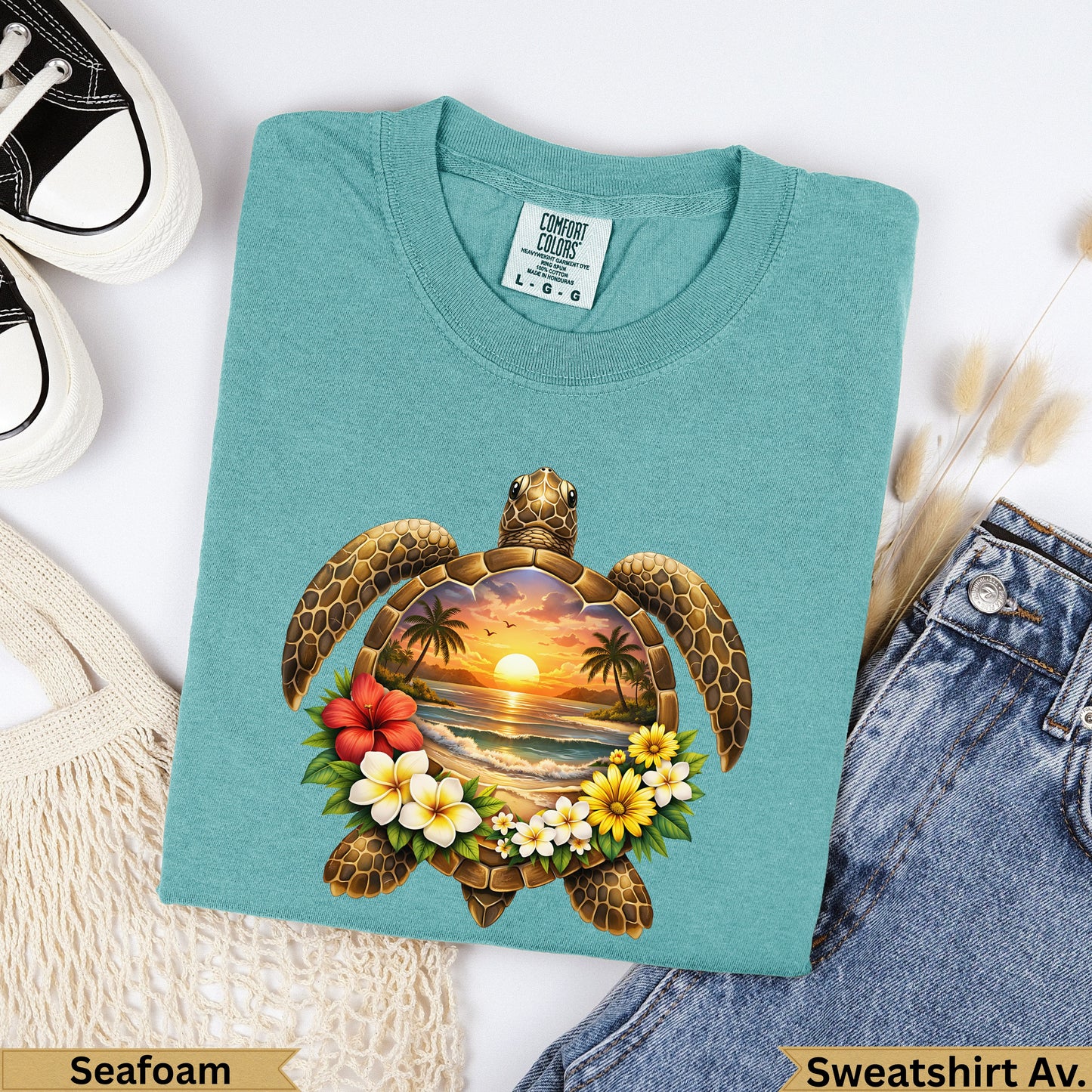 Teal Comfort Colors sweatshirt with a sea turtle graphic and tropical sunset scene.