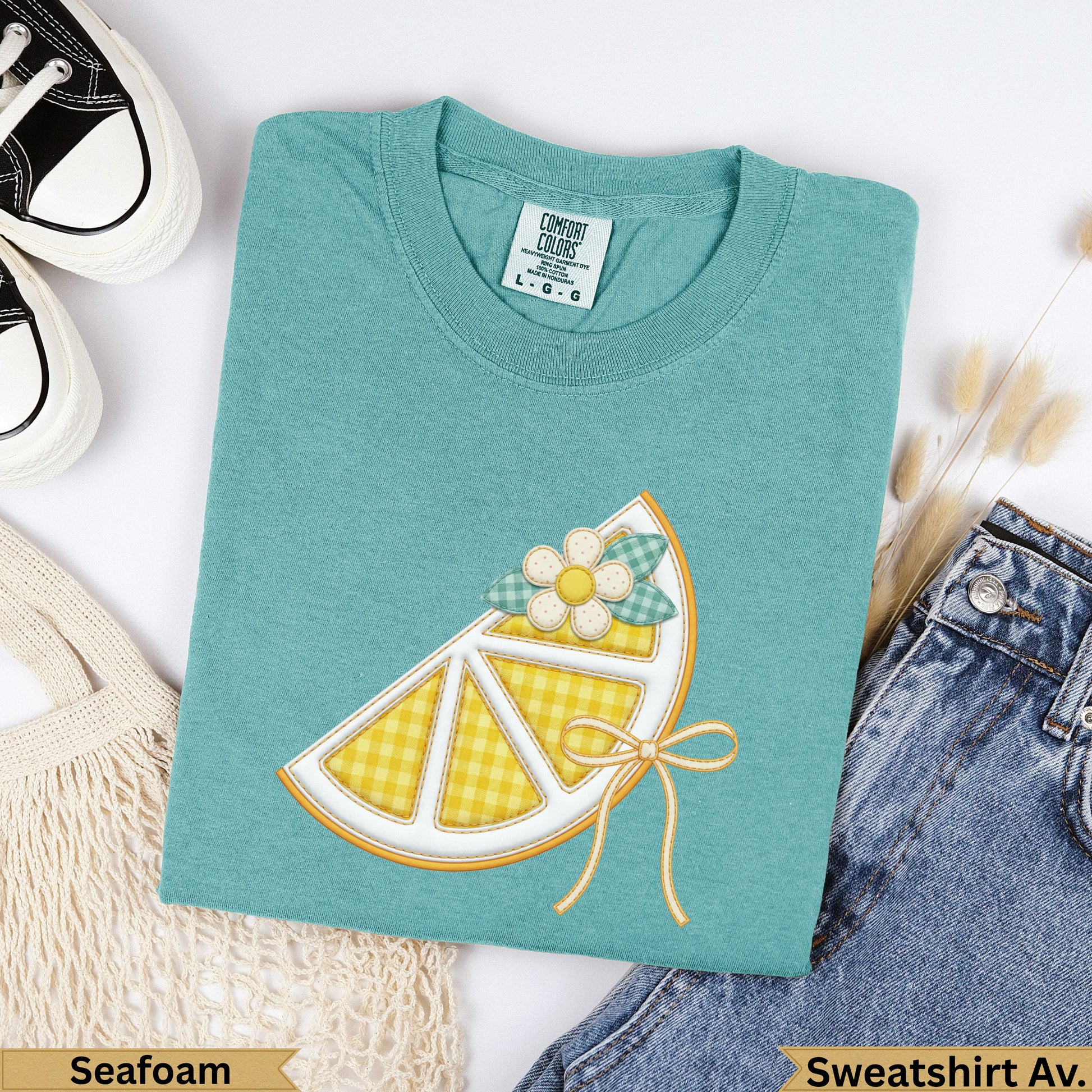 Teal Comfort Colors sweatshirt with a yellow gingham lemon slice graphic.