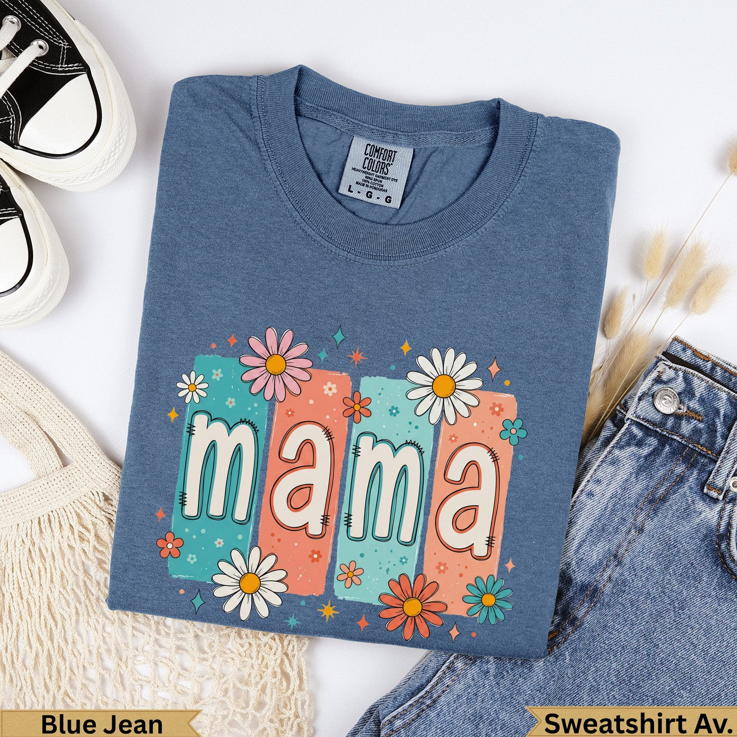 Blue t-shirt with "mama" in colorful lettering surrounded by flowers.