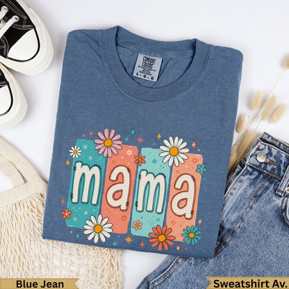 Blue t-shirt with "mama" in colorful lettering surrounded by flowers.