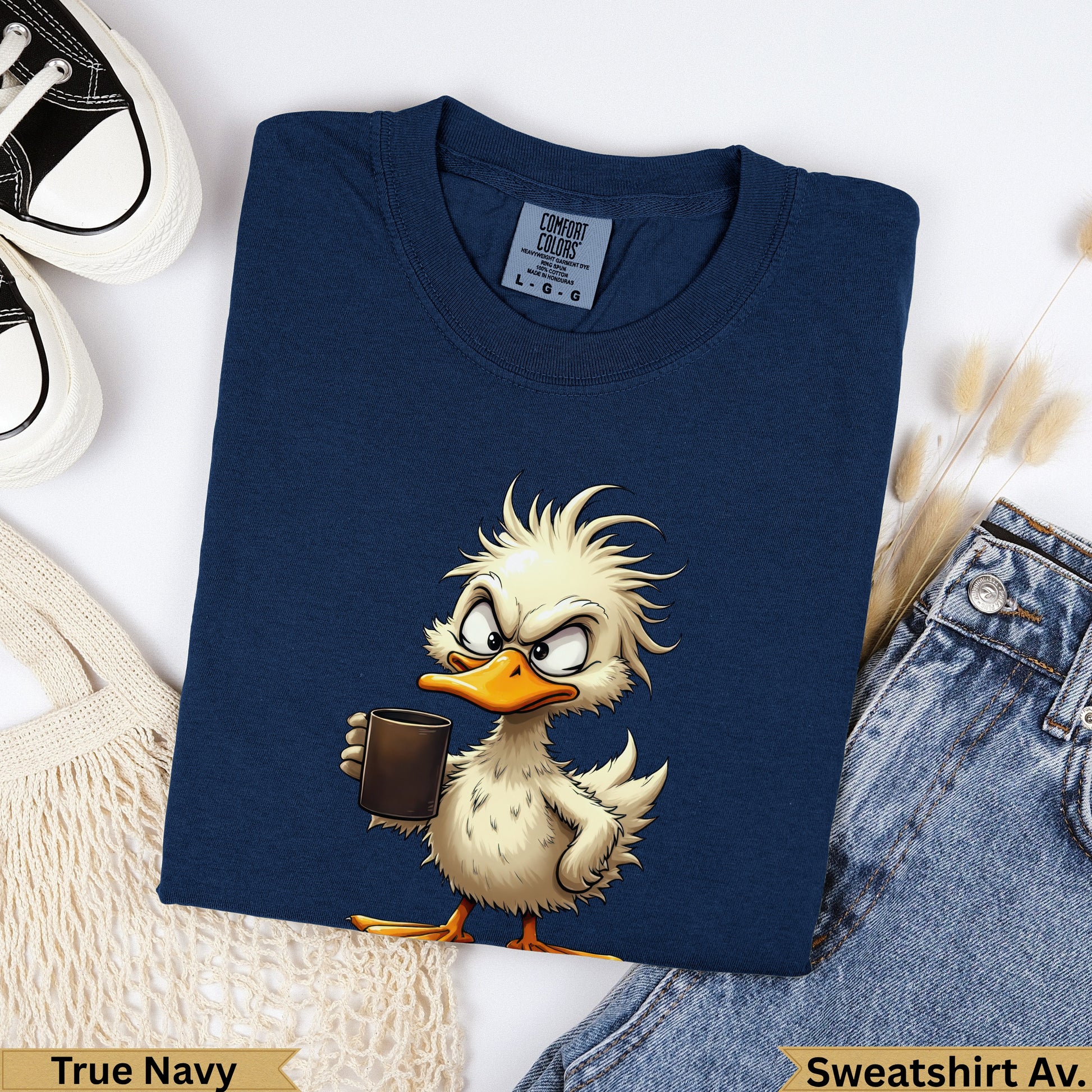 Cartoon duck holding coffee cup on navy blue sweatshirt.
