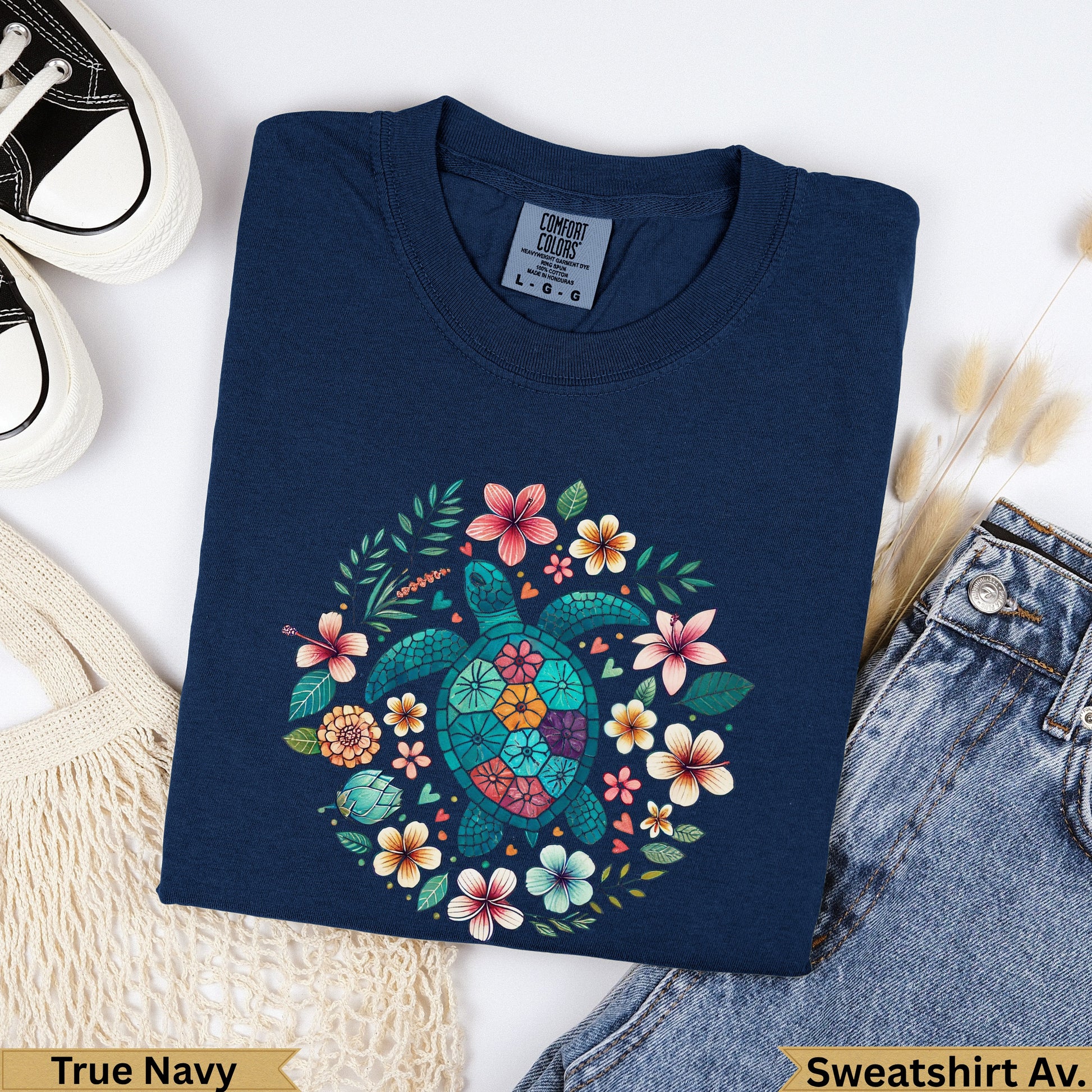 Navy blue Comfort Colors sweatshirt with a teal sea turtle and floral wreath graphic.
