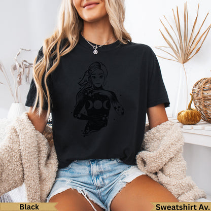 Black t-shirt with celestial woman graphic and moon phases.