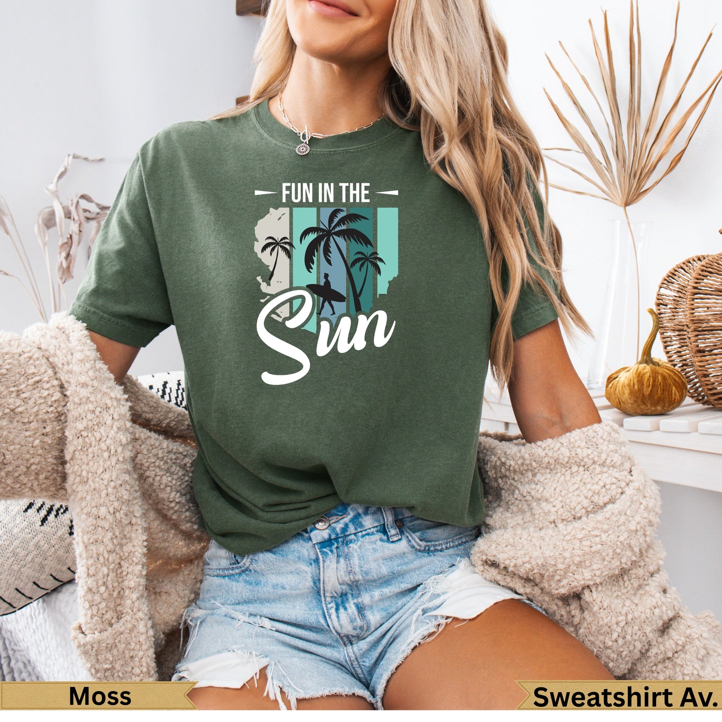 Green t-shirt with "Fun in the Sun" graphic and palm trees.