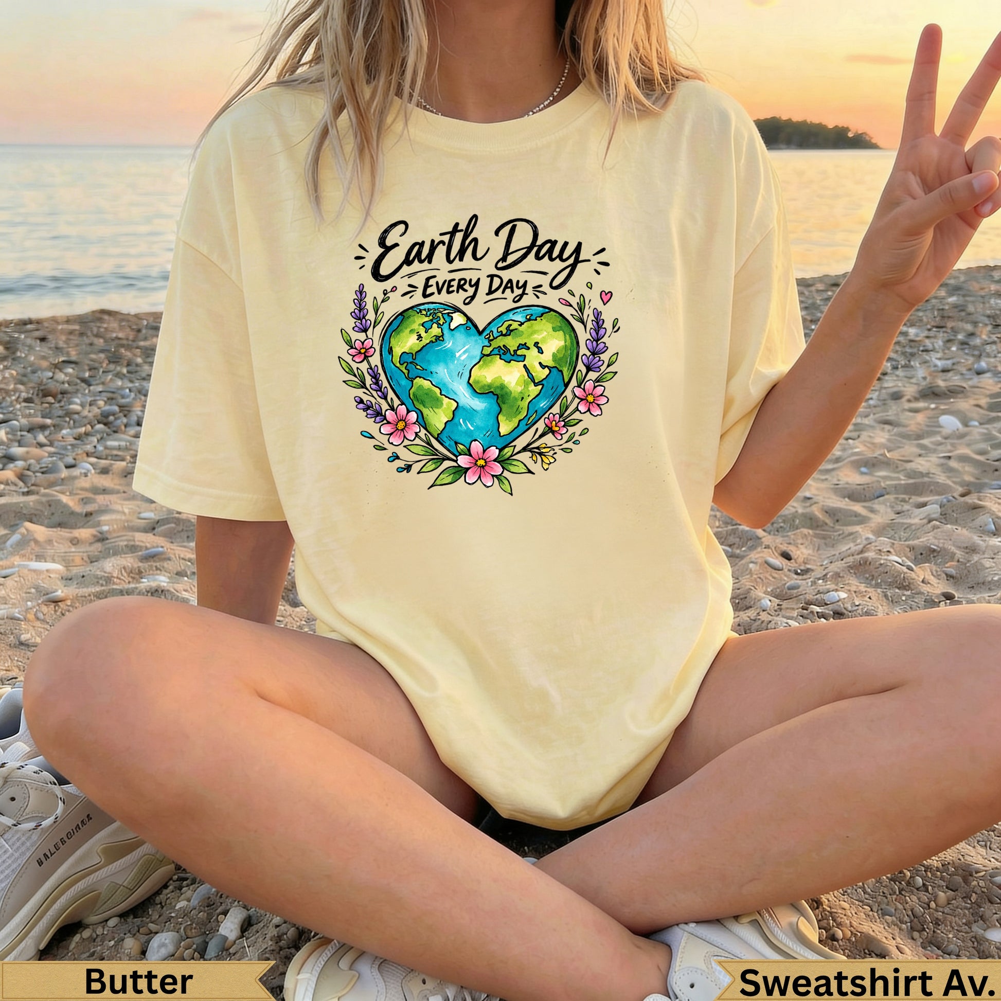 Yellow t-shirt with Earth Day heart graphic and text.