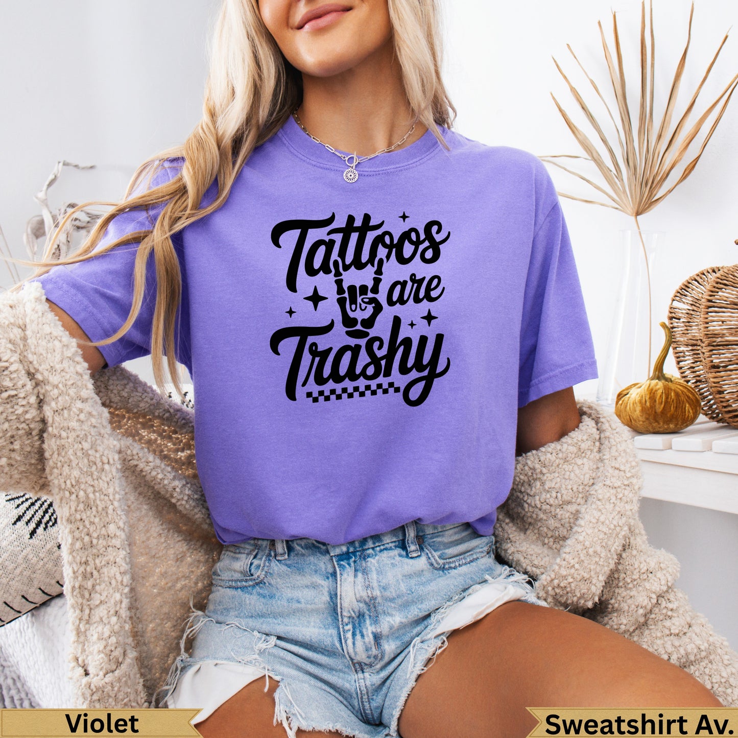 Purple t-shirt with "Tattoos are trashy" graphic and checkered pattern.