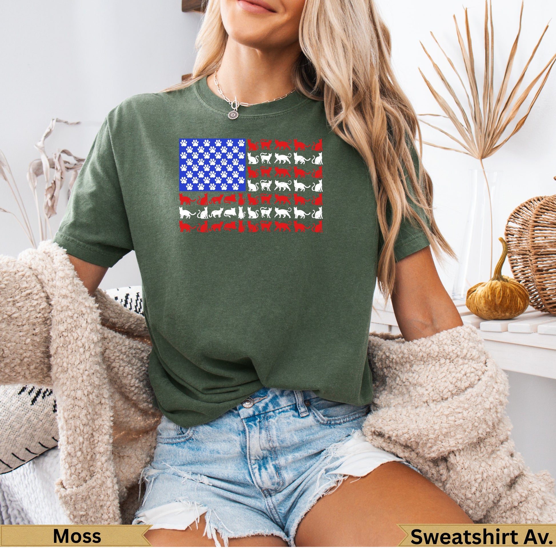 Green t-shirt with a USA flag pattern made of white cat silhouettes.