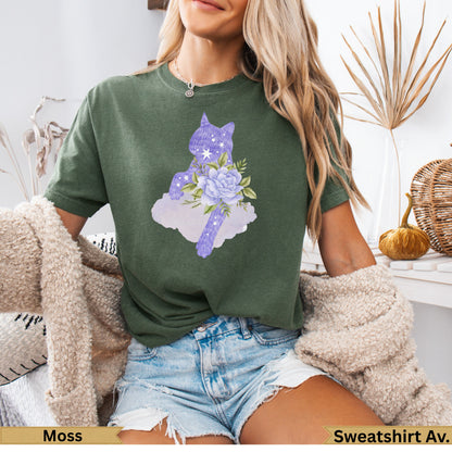 Green t-shirt with a purple cat silhouette and floral accents.