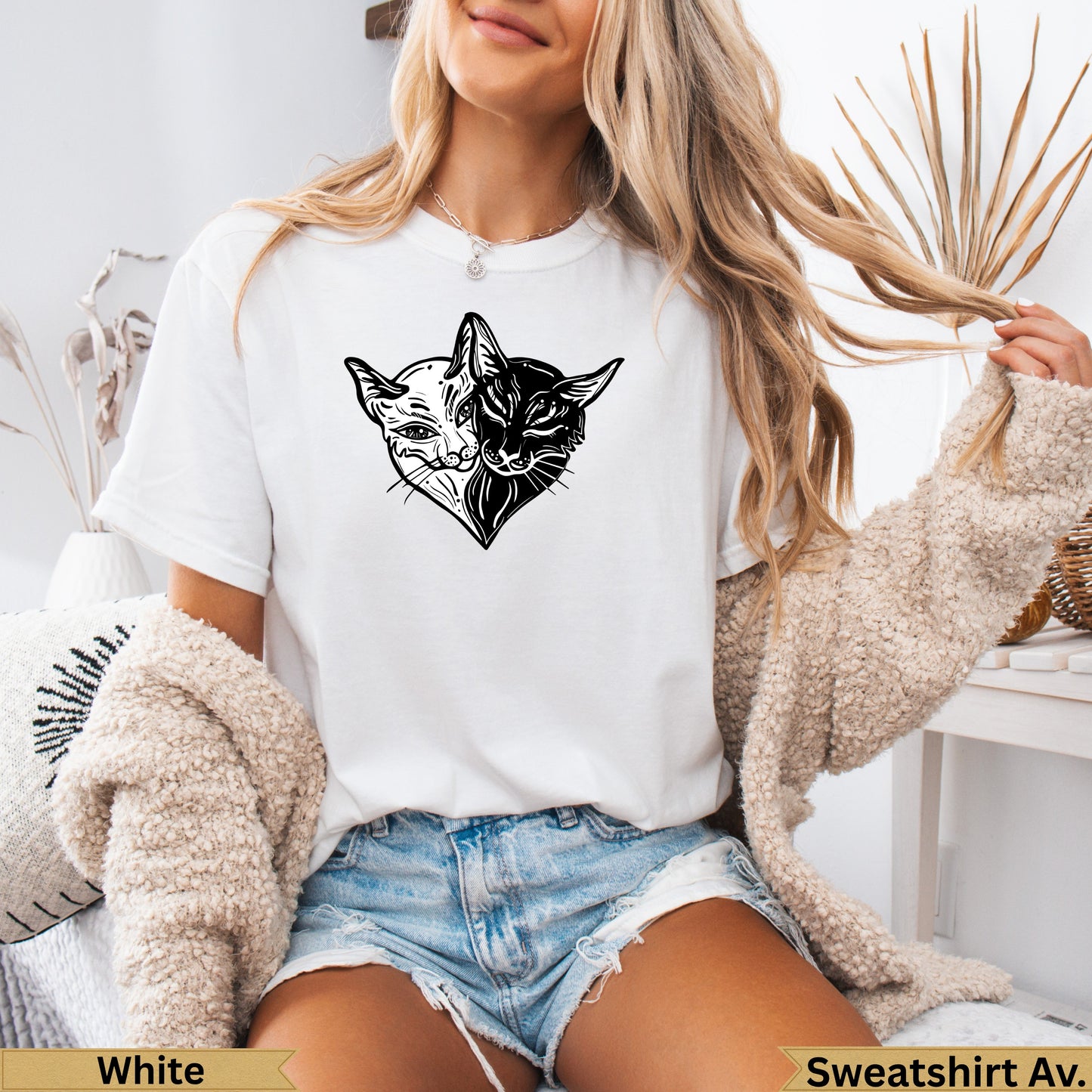 White t-shirt with a black and white Siamese cat head design.