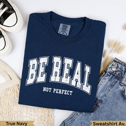 Navy blue Comfort Colors sweatshirt with "BE REAL NOT PERFECT" text.