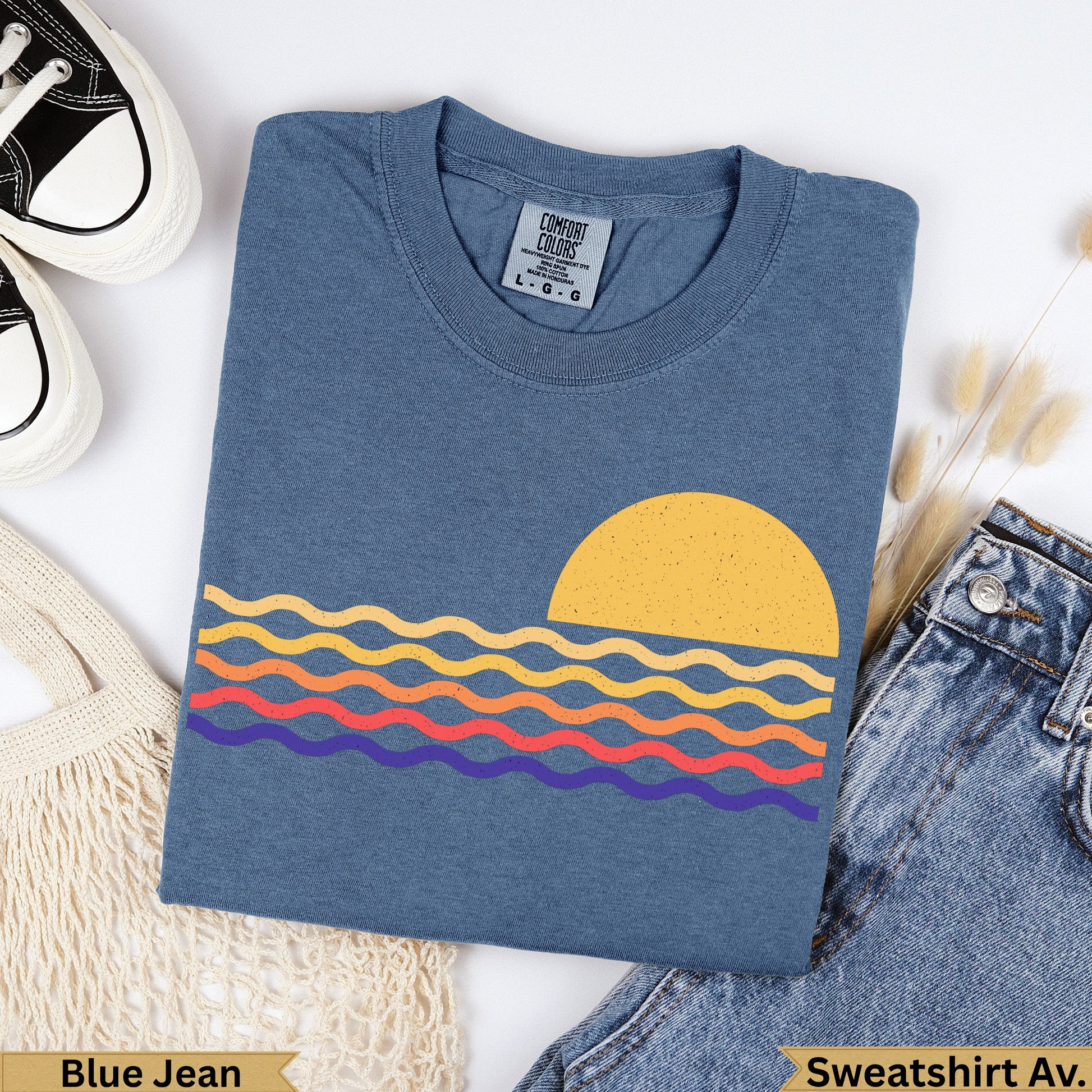 Blue Jean Comfort Colors sweatshirt with sun and wavy lines graphic.