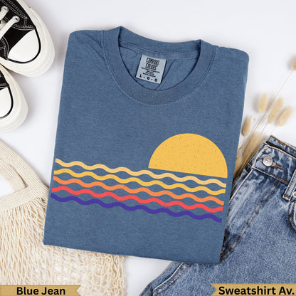 Blue Jean Comfort Colors sweatshirt with sun and wavy lines graphic.