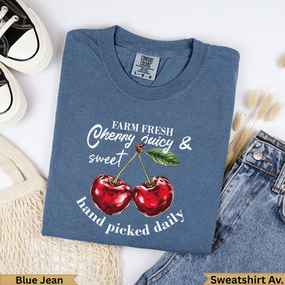 Blue Jean t-shirt with "Farm Fresh Cherry Juicy & Sweet Hand Picked Daily" text and graphic.