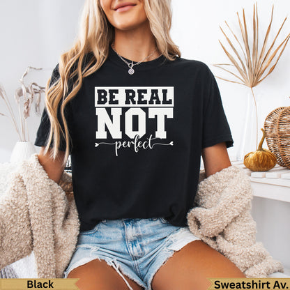 Black t-shirt with "BE REAL NOT perfect" text and small heart detail.