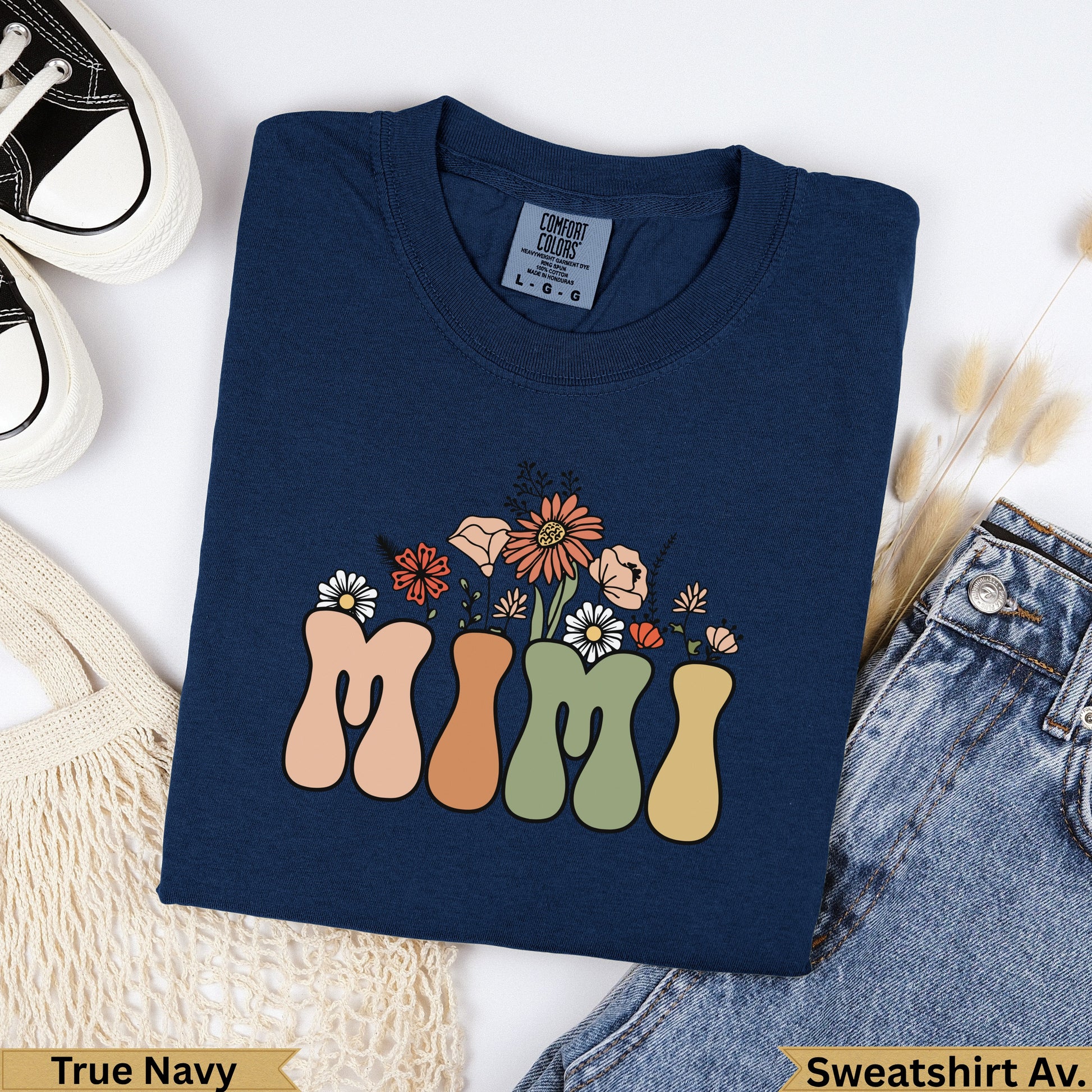 Navy sweatshirt with "MIMI" text and floral graphic.