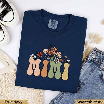 Navy sweatshirt with "MIMI" text and floral graphic.