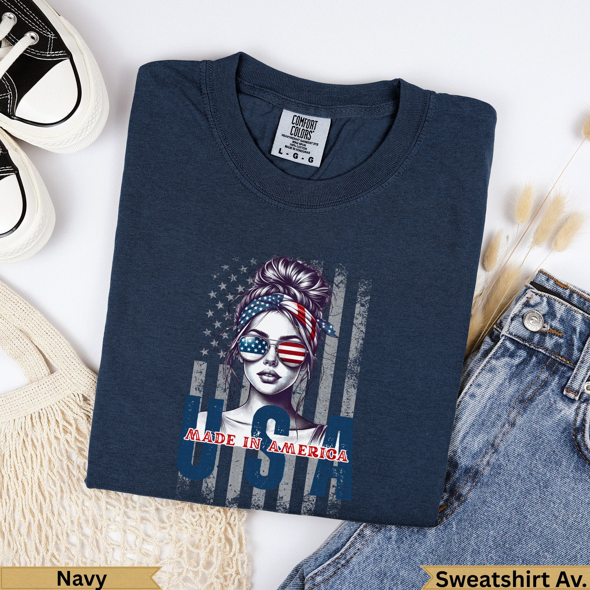 Navy Comfort Colors sweatshirt with "Made in America" graphic featuring a woman wearing American flag sunglasses.