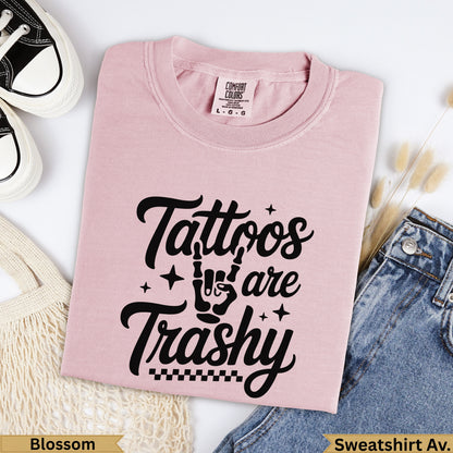 Pink Comfort Colors sweatshirt with "Tattoos are Trash" graphic.