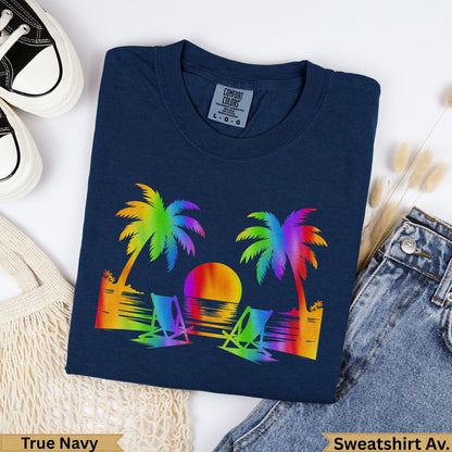 Navy t-shirt with rainbow palm trees, beach chairs, and sunset graphic.