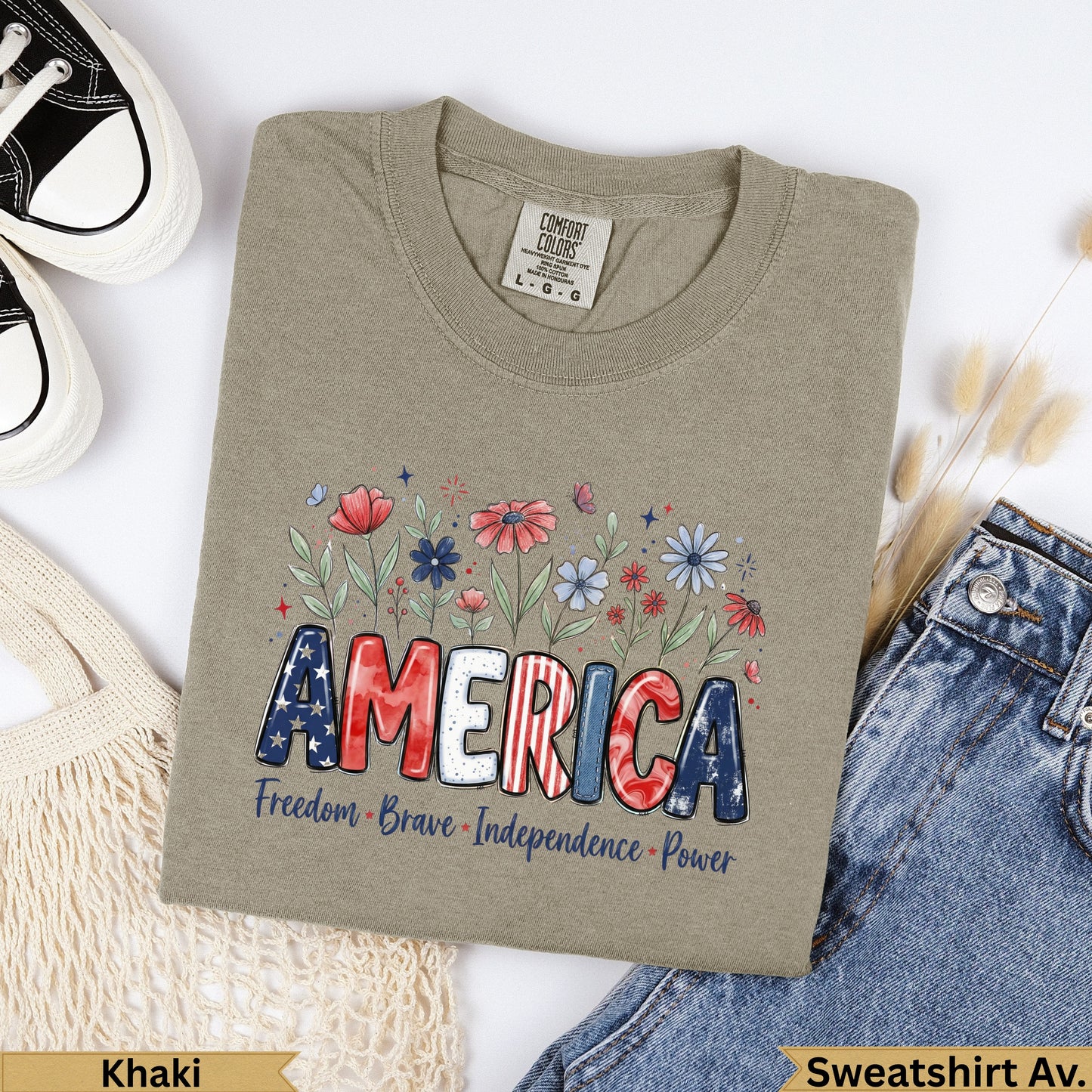 Khaki t-shirt with "AMERICA" in patriotic font and floral accents.