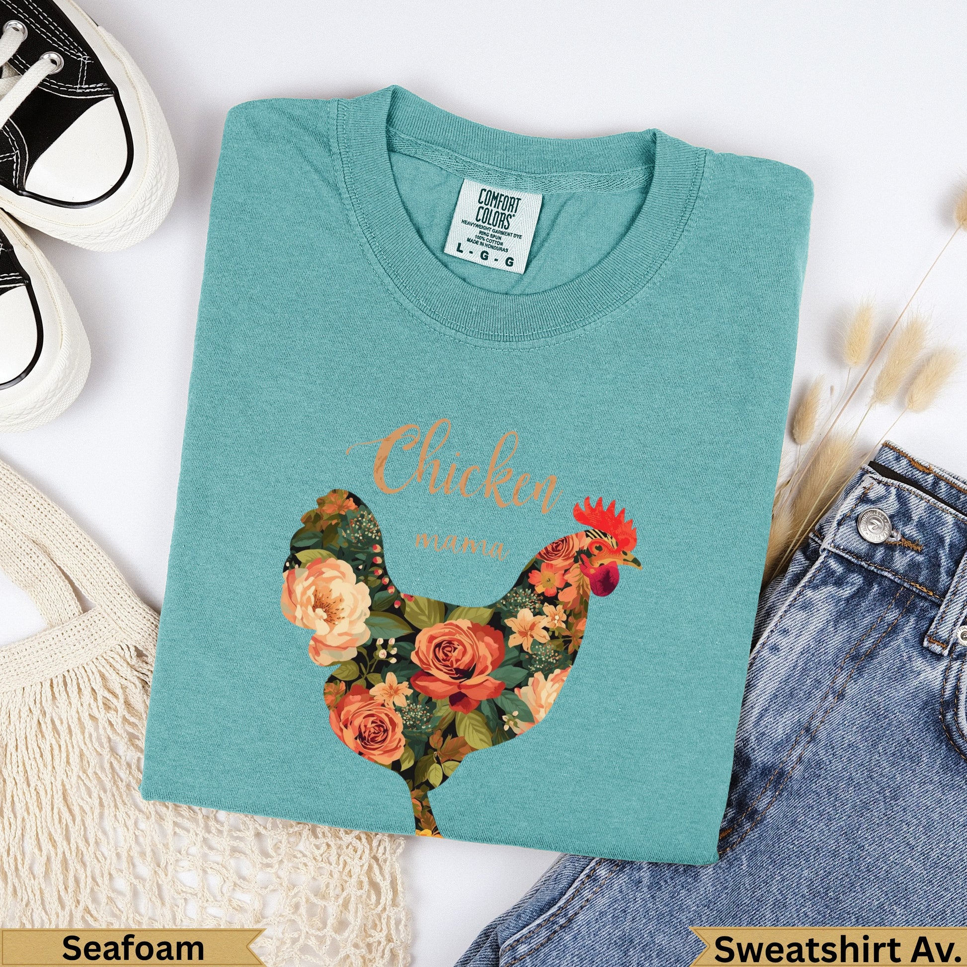 Teal Comfort Colors sweatshirt with floral chicken graphic and "Chicken" text.