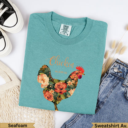 Teal Comfort Colors sweatshirt with floral chicken graphic and "Chicken" text.