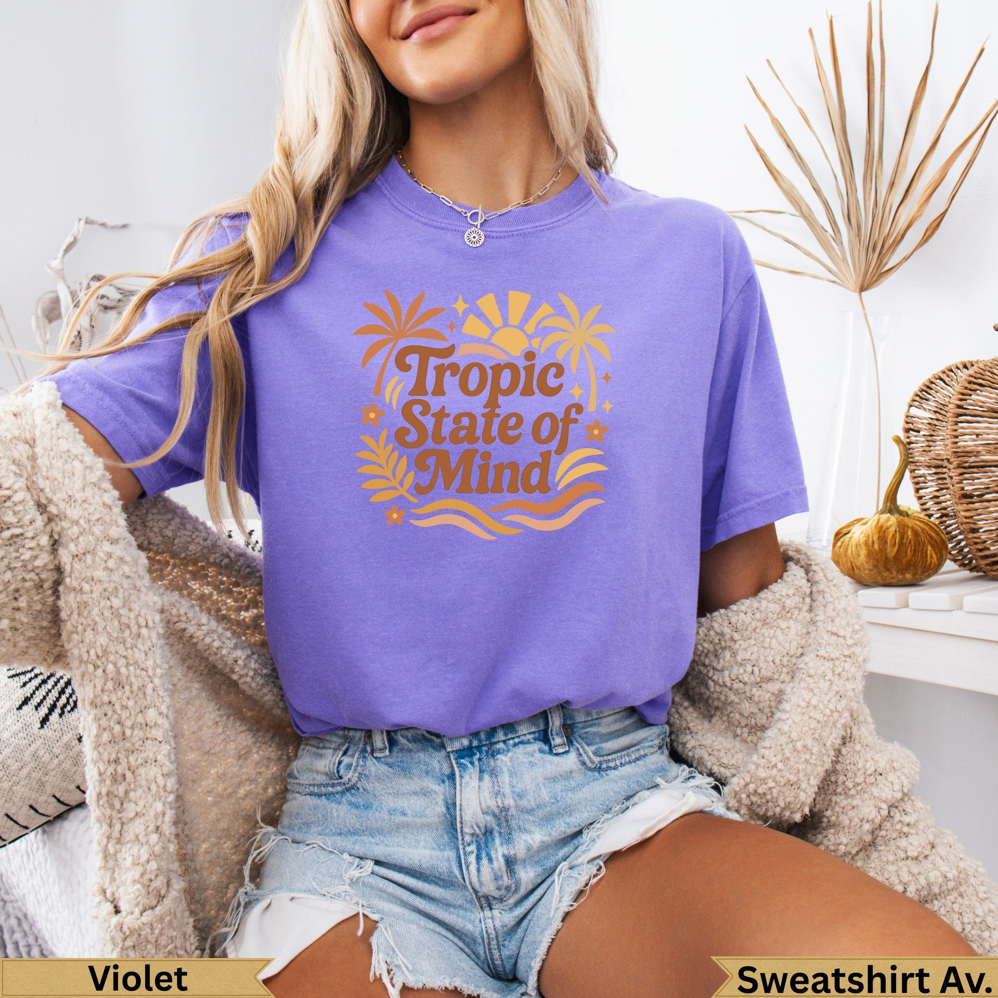Purple t-shirt with "Tropic State of Mind" text and palm trees.