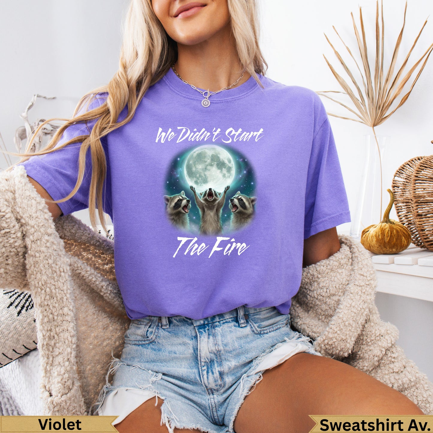Purple t-shirt with three raccoons and text "We Didn't Start The Fire".