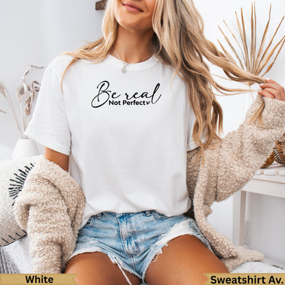 White t-shirt with "Be real Not perfect" text, worn by a woman.