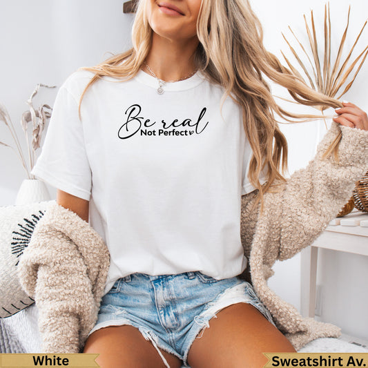 White t-shirt with "Be real Not perfect" text, worn by a woman.