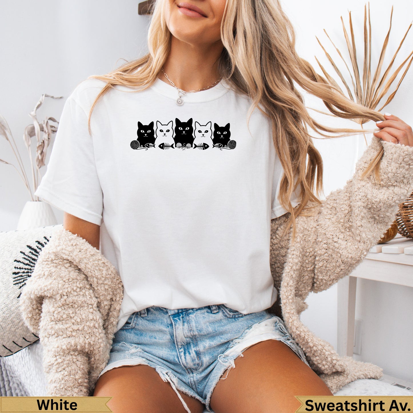 White t-shirt with black cat graphic and "Sweatshirt Av." text.