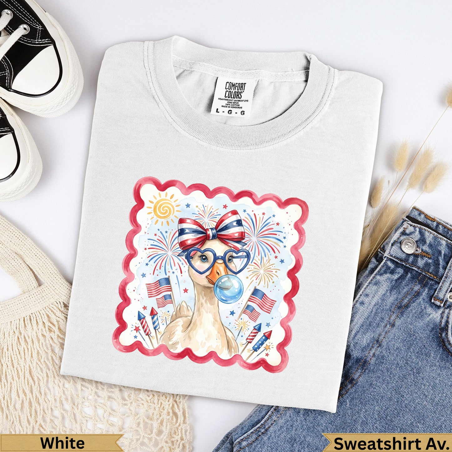 White Comfort Colors sweatshirt with patriotic duck graphic and red, white, blue fireworks.