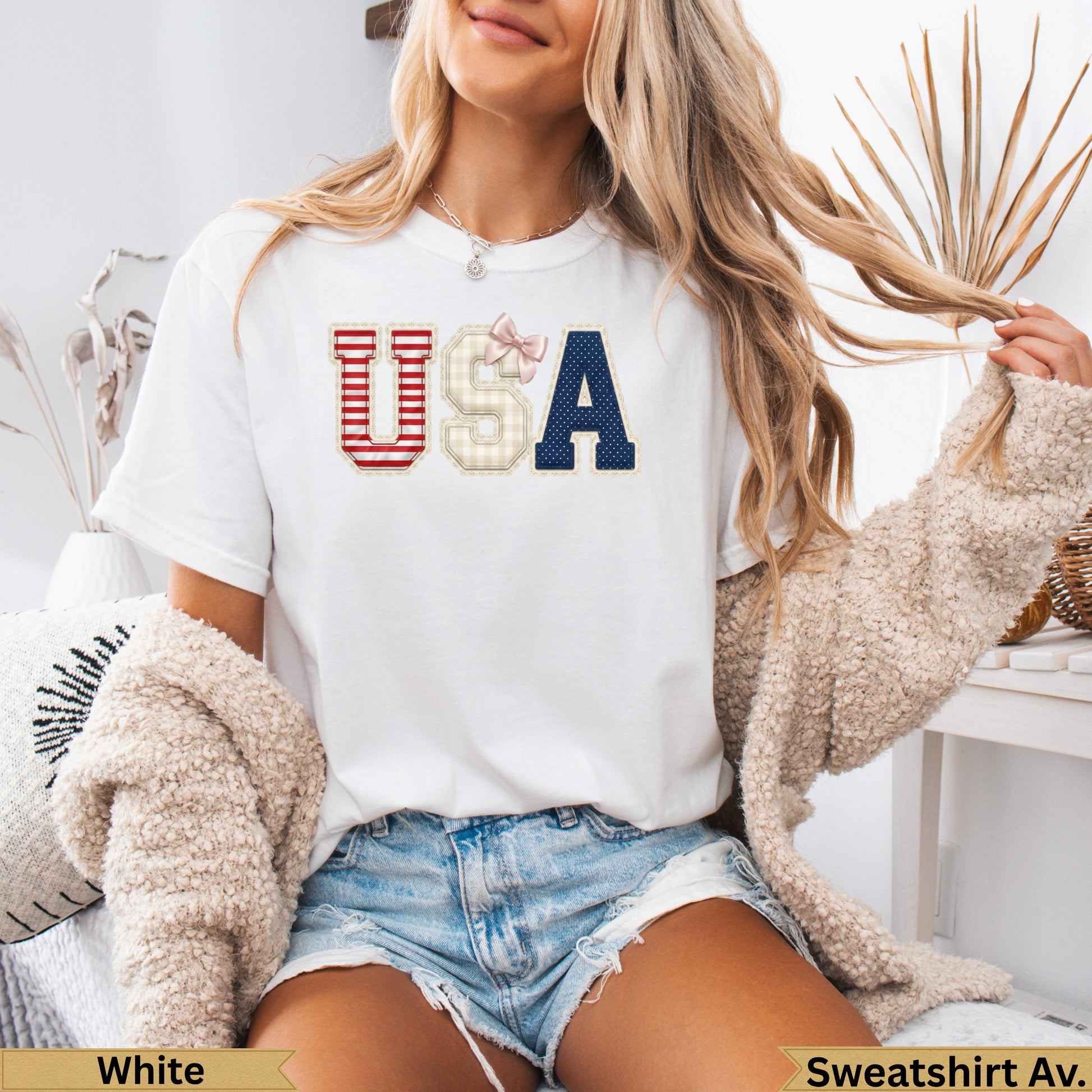 White t-shirt with "USA" in patriotic plaid and navy blue lettering.