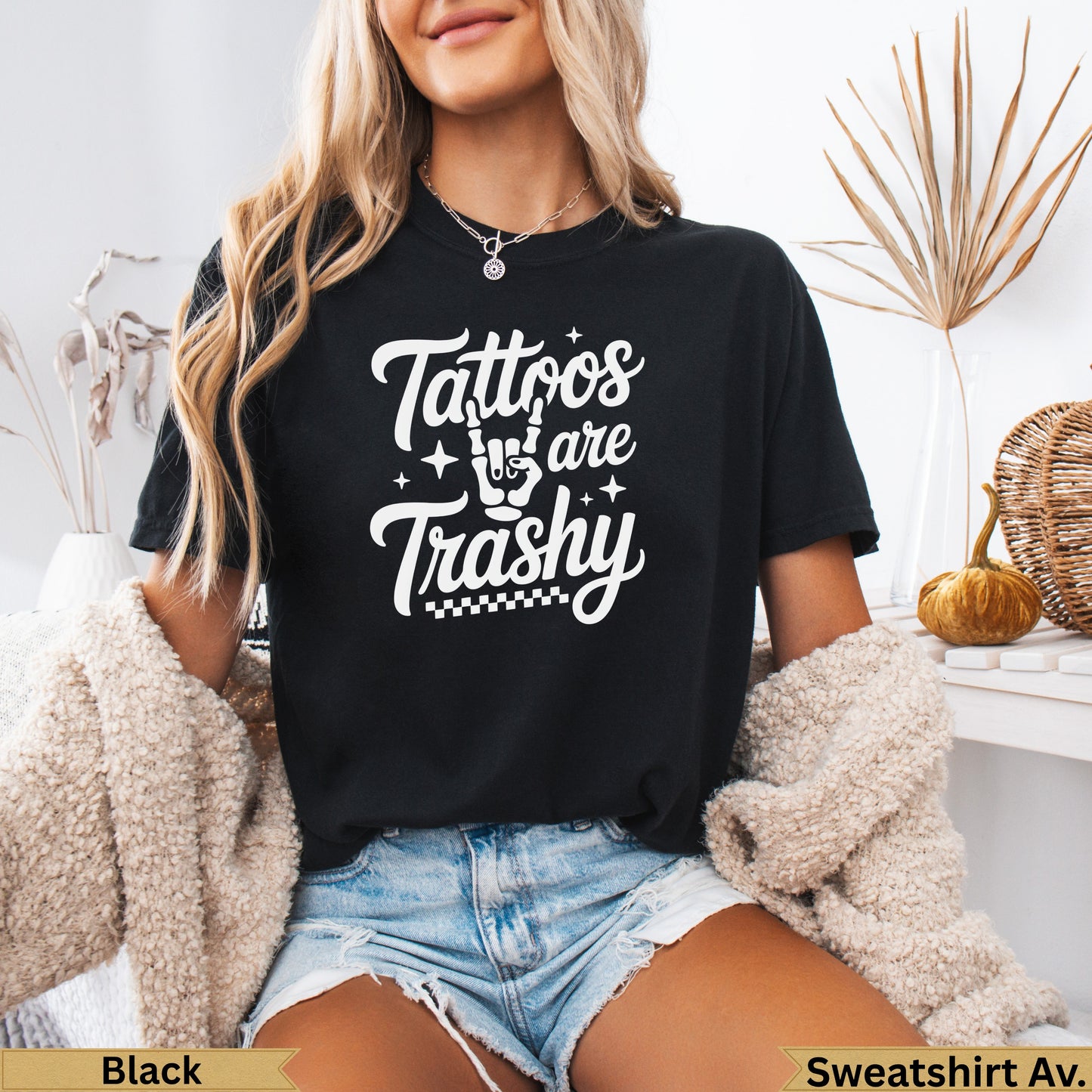 Black sweatshirt with "Tattoos are Trashy" graphic in white script.