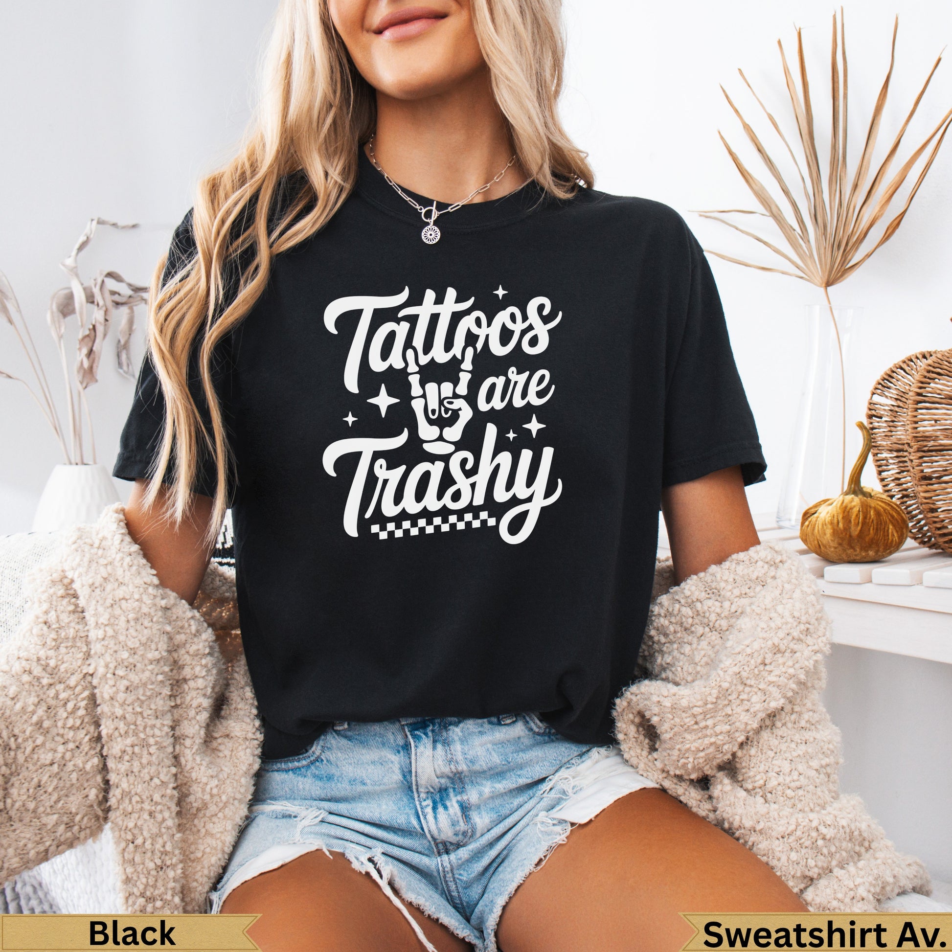 Black sweatshirt with "Tattoos are Trashy" graphic in white script.
