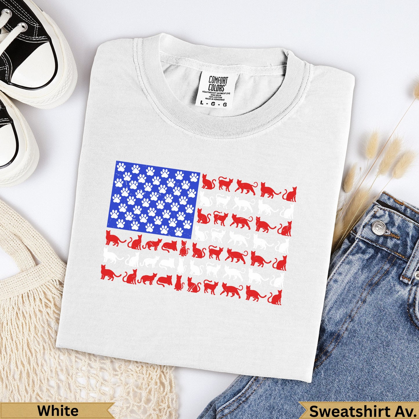 T-shirt with American flag design made of cat paw prints and cats.