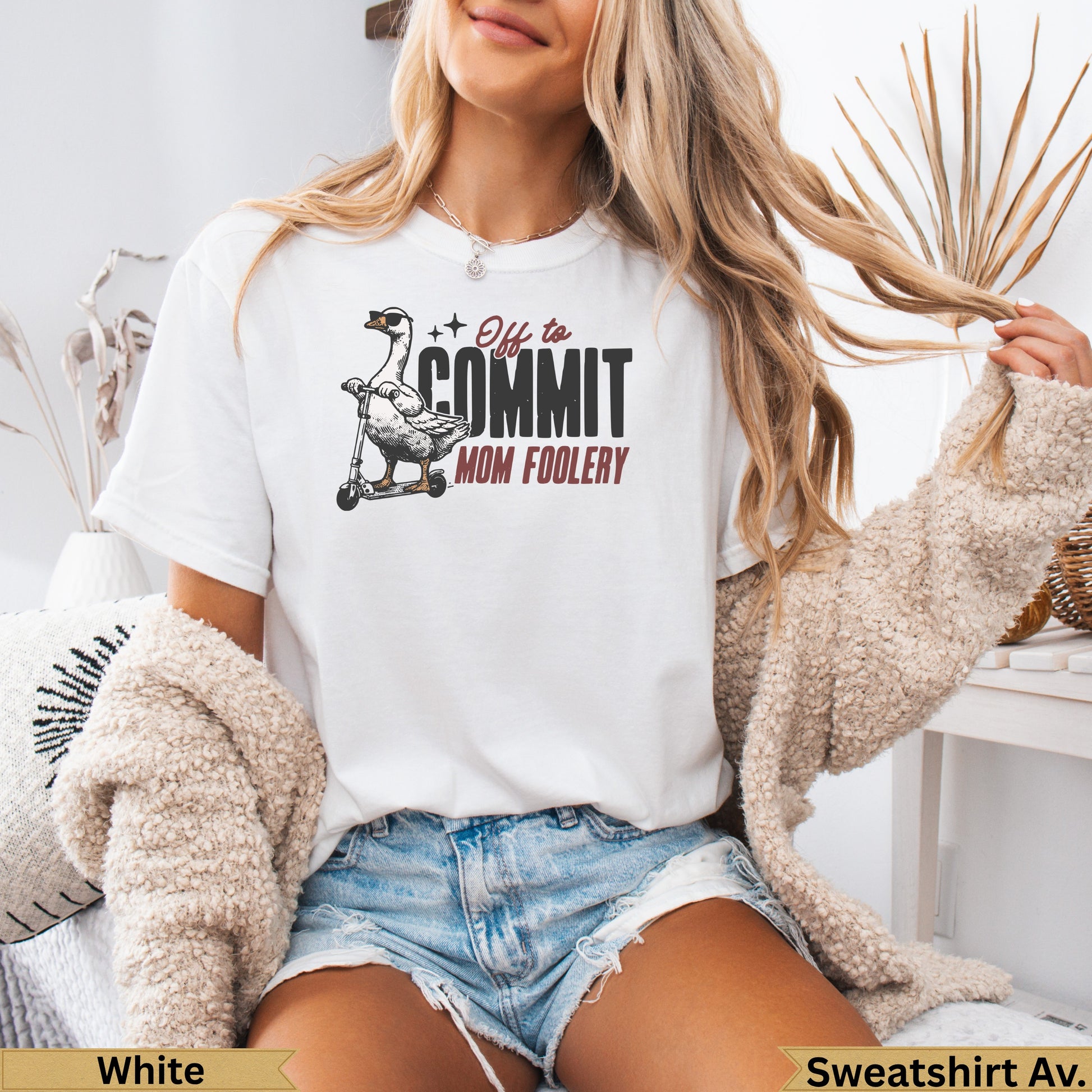 White t-shirt with a goose on a scooter and "Off to Commit Mom Foolery" text.