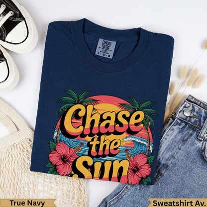 Navy blue sweatshirt with "Chase the Sun" graphic, palm trees, and waves.
