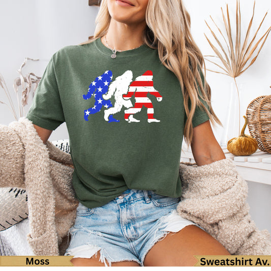 Green t-shirt with Bigfoot silhouette in American flag pattern.