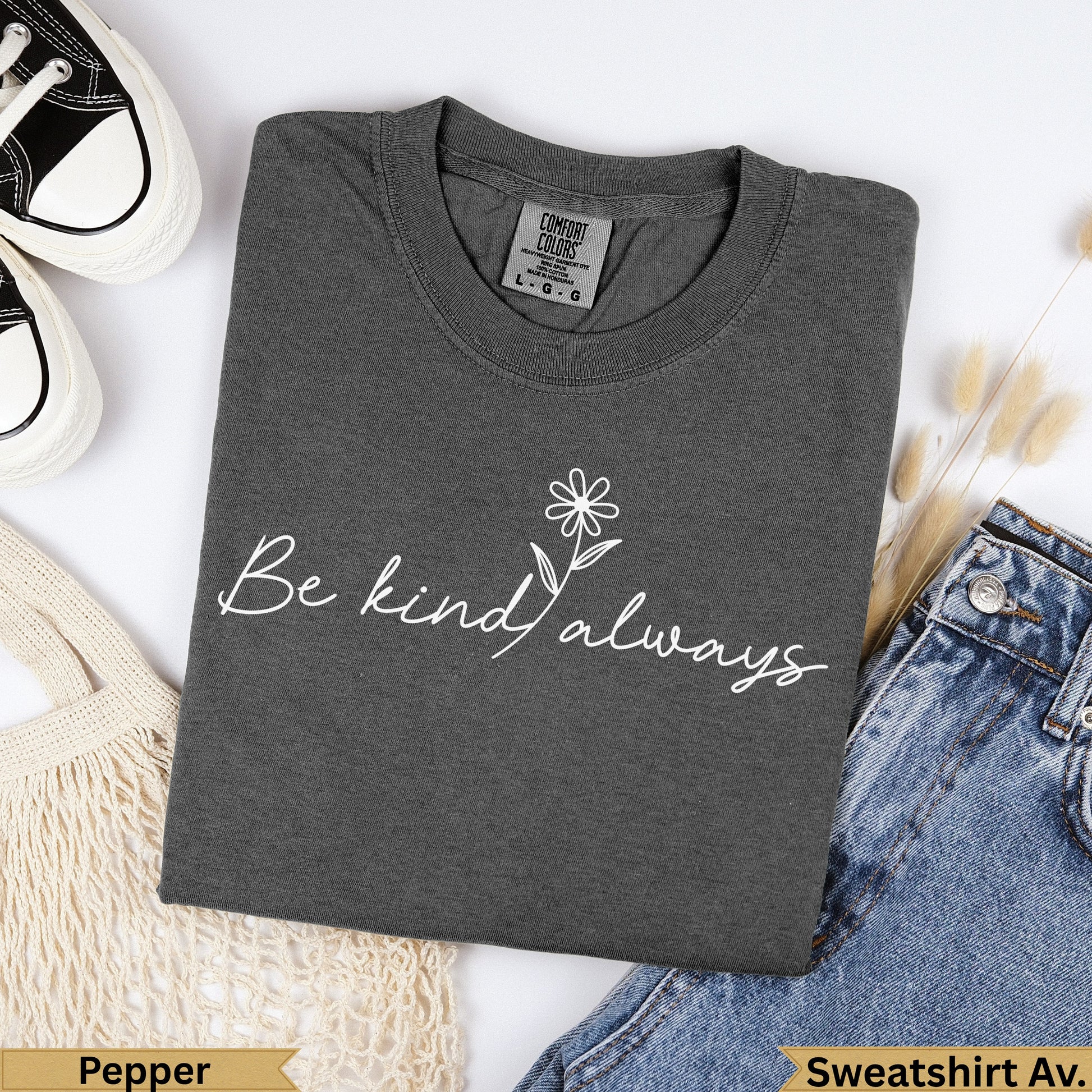 Dark gray t-shirt with "Be kind always" in white script and a small flower.
