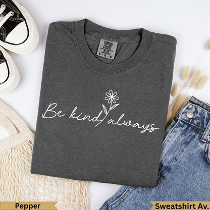 Dark gray t-shirt with "Be kind always" in white script and a small flower.