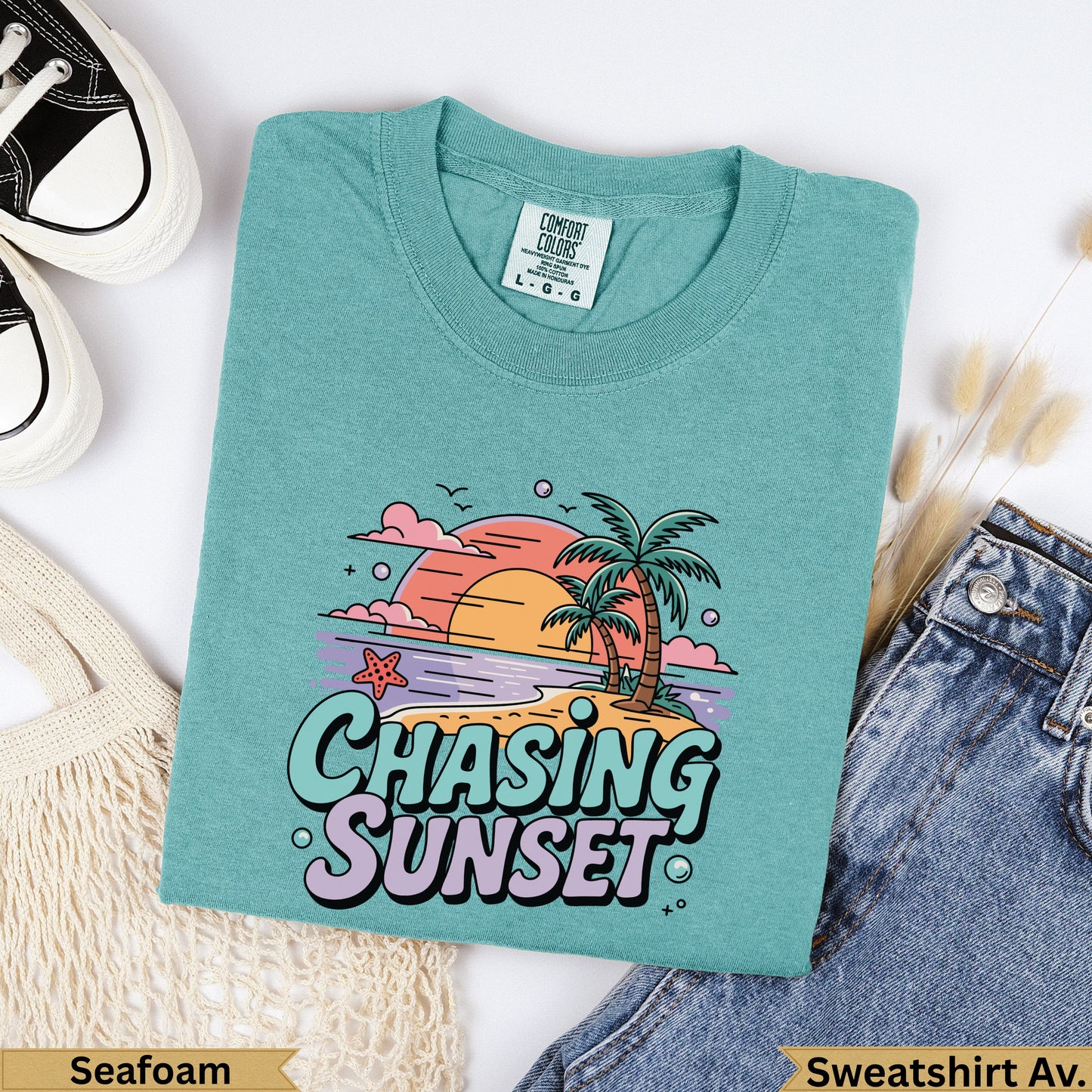 Teal Comfort Colors sweatshirt with "Chasing Sunset" graphic and palm trees.