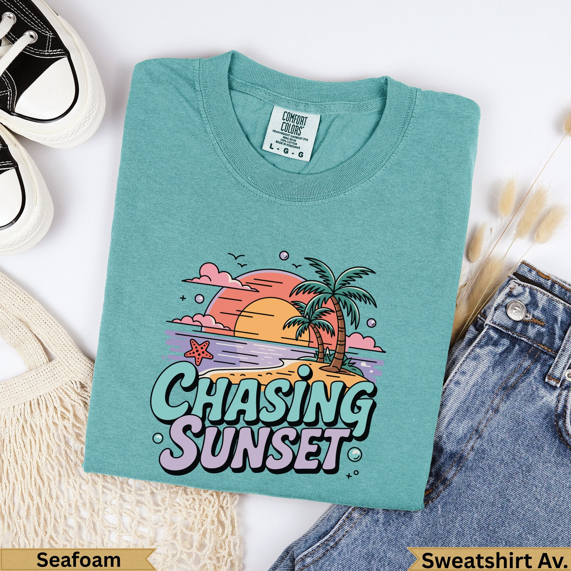 Teal Comfort Colors sweatshirt with "Chasing Sunset" graphic and palm trees.
