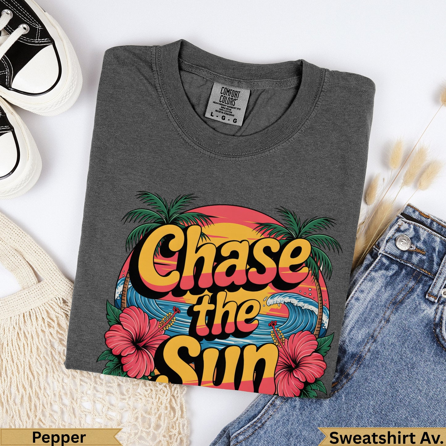 Dark grey Comfort Colors sweatshirt with "Chase the Sun" graphic and tropical details.