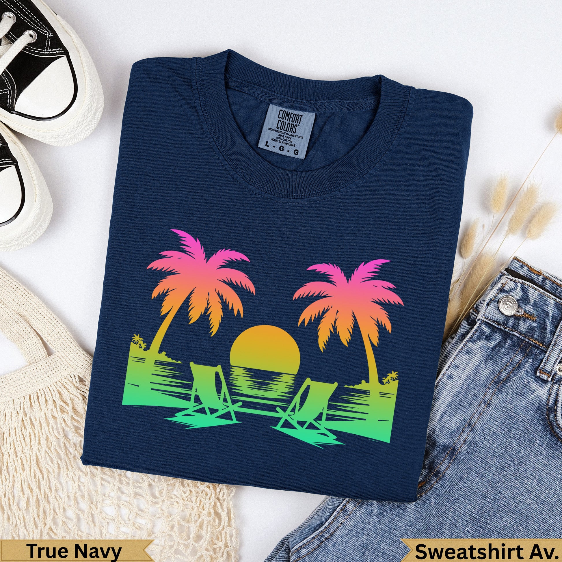 Navy t-shirt with tropical sunset graphic and "True Navy" text.