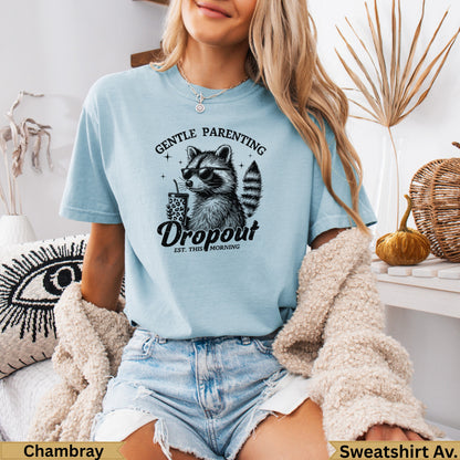 Light blue t-shirt with raccoon wearing sunglasses holding a coffee cup.