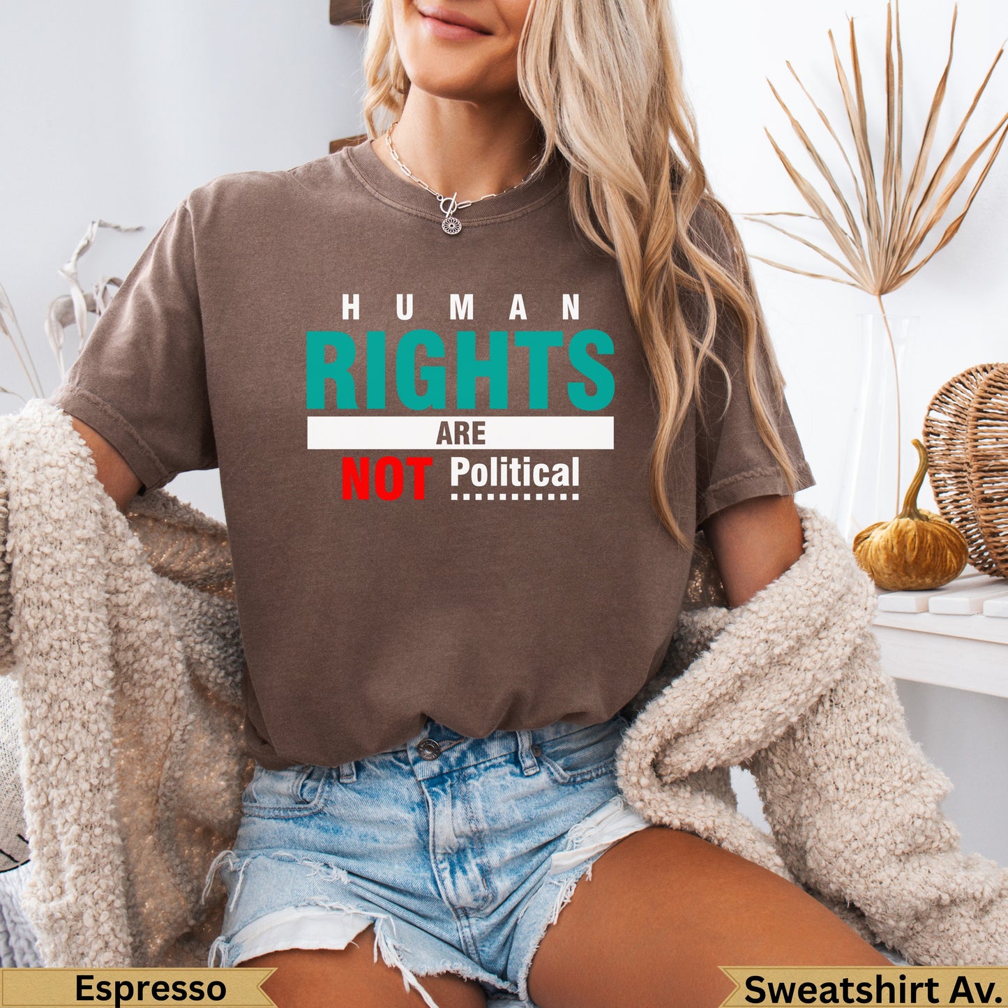 Brown sweatshirt with "HUMAN RIGHTS ARE NOT Political" text.