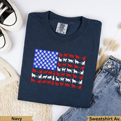 Navy t-shirt with American flag design made of white cat silhouettes and paw prints.