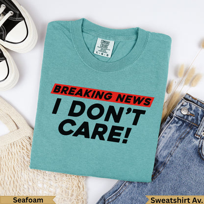 Teal Comfort Colors t-shirt with "BREAKING NEWS I DON'T CARE!" graphic.