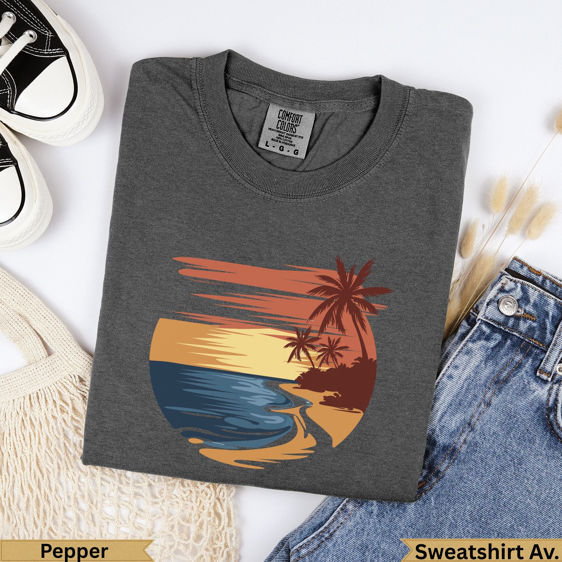 Dark grey Comfort Colors t-shirt with sunset beach graphic and text.